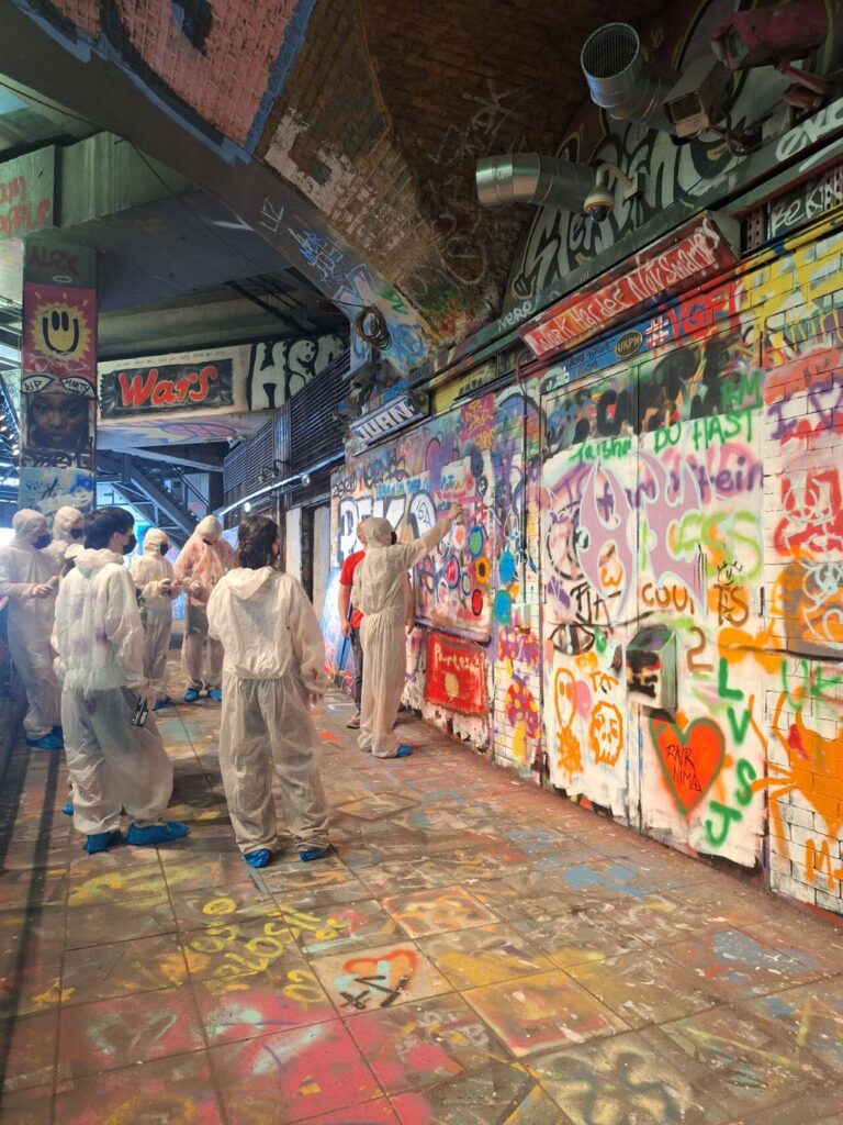 Artists painting Graffiti at Leake Street