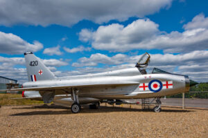English Electric Lightning fighter jet at Farnborough Air Sciences Trust museum under a blue sky.